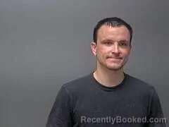 Mugshot of TYLER C HUTTON booked in Baxter County, Arkansas on May 13, 2026