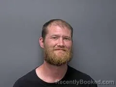 Mugshot of TRAVIS L GODAT booked in Baxter County, Arkansas on June 15, 2026