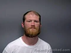 Mugshot of TRAVIS L GODAT booked in Baxter County, Arkansas on June 19, 2026