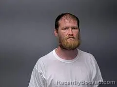 Mugshot of TRAVIS L GODAT booked in Baxter County, Arkansas on July 3, 2026