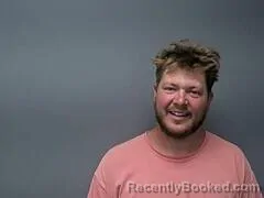 Mugshot of TREVOR J OLSON booked in Baxter County, Arkansas on July 8, 2026