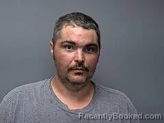 Mugshot of JUSTIN E BURCH booked in Baxter County, Arkansas on July 19, 2026