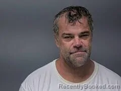 Mugshot of Chris A Brim booked in Baxter County, Arkansas on October 4, 2026