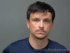 Mugshot of Tyler C Hutton booked in Baxter County, Arkansas on October 12, 2026