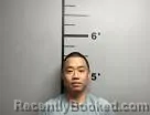 Mugshot of Alex Yau Hau booked in Benton County, Arkansas on May 27, 2026