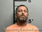Mugshot of Tommy Robinson booked in Benton County, Arkansas on July 18, 2026
