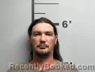 Mugshot of Justin Robertson booked in Benton County, Arkansas on July 18, 2026