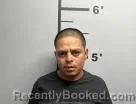 Mugshot of Juan Melara-Flores booked in Benton County, Arkansas on August 7, 2026