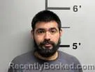 Mugshot of Benjamin Holguin booked in Benton County, Arkansas on September 2, 2026