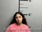 Mugshot of Melanie Flores booked in Benton County, Arkansas on October 14, 2026