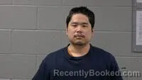 Mugshot of WENYUAN SONG booked in Carroll County, Arkansas on April 10, 2026