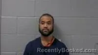 Mugshot of MABINI T GEORGE booked in Carroll County, Arkansas on May 13, 2026