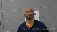 Mugshot of MACKSON GEORGE booked in Carroll County, Arkansas on July 8, 2026
