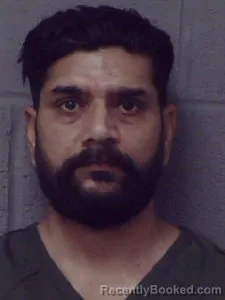Mugshot of Nogivenname Parveen Kumar booked in Crittenden County, Arkansas on July 7, 2026