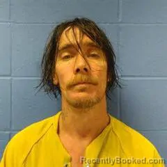 Mugshot of JUSTIN SCROGGINS booked in Faulkner County, Arkansas on March 29, 2026