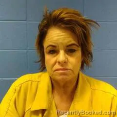 Mugshot of KIMBERLY DOOMS booked in Faulkner County, Arkansas on April 7, 2026