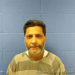 Mugshot of RAHIM RAJWANI booked in Faulkner County, Arkansas on July 18, 2026