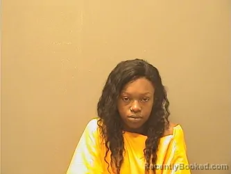 Mugshot of Aiyana Denice Higgins booked in Garland County, Arkansas on October 6, 2026