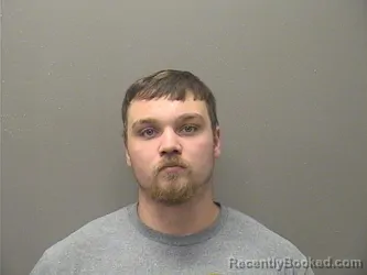 Mugshot of Ashton Duane Topham booked in Garland County, Arkansas on October 4, 2026
