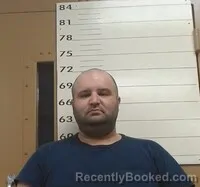 Mugshot of ADEM GUN booked in Hot Springs County, Arkansas on April 15, 2026