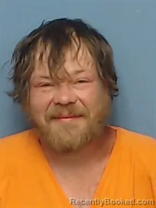 Mugshot of John Kennedy Grigg booked in Madison County, Arkansas on April 21, 2026