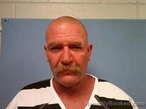 Mugshot of Joshua Thomas Warren booked in Madison County, Arkansas on July 14, 2026