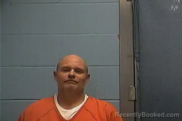 Mugshot of TRAVIS A BURDUE