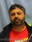 Mugshot of INDUVARDHAN SURINENI booked in Pulaski County, Arkansas on May 1, 2026