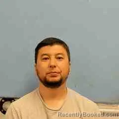 Mugshot of Sanjarbek Muydinov booked in St Francis County, Arkansas on October 6, 2026