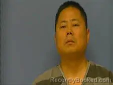 Mugshot of XIAOPENG DING booked in Saline County, Arkansas on May 3, 2026