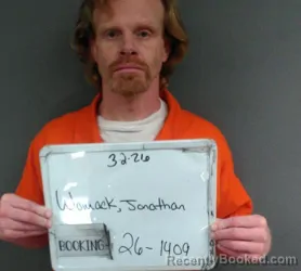 Mugshot of JONATHAN AZRA WOMACK