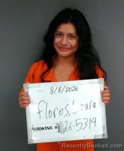 Mugshot of Laura Flores booked in Sebastian County, Arkansas on August 8, 2026