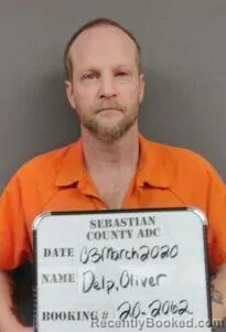 Mugshot of Oliver Jefferson Delp booked in Sebastian County, Arkansas on August 9, 2026
