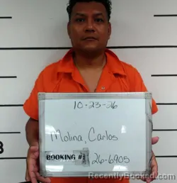 Mugshot of Carlos Alberto Molina booked in Sebastian County, Arkansas on October 23, 2026