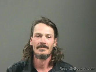 Mugshot of Justin Voyles booked in Washington County, Arkansas on March 12, 2026