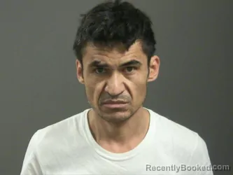 Mugshot of Karim Akhlaqi booked in Washington County, Arkansas on March 16, 2026