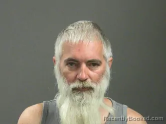 Mugshot of Travis Yoss booked in Washington County, Arkansas on March 19, 2026