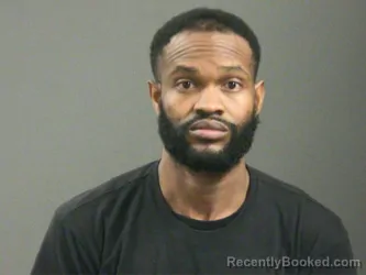 Mugshot of Boaz Louigene booked in Washington County, Arkansas on March 19, 2026