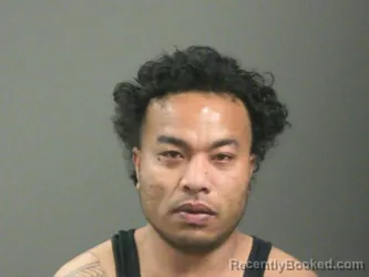 Mugshot of Alokoa Lajar booked in Washington County, Arkansas on March 21, 2026