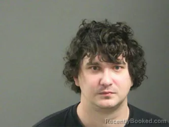 Mugshot of Norman Gilbert booked in Washington County, Arkansas on March 28, 2026