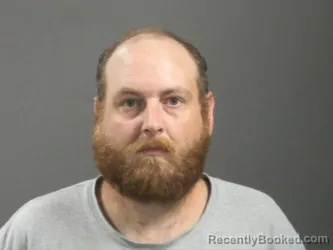 Mugshot of Justin John booked in Washington County, Arkansas on July 31, 2026