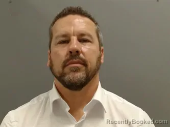 Mugshot of Jason Carney booked in Washington County, Arkansas on October 14, 2026