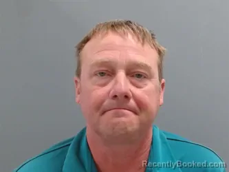 Mugshot of John Alexander booked in Washington County, Arkansas on October 22, 2026