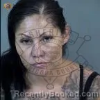 Mugshot of Julia Dolores Romero-Enriquez booked in Maricopa County, Arizona on August 12, 2026