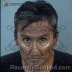 Mugshot of Ronald Kim Ambalong booked in Maricopa County, Arizona on August 14, 2026