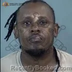 Mugshot of Joel Kalovwe Mwove booked in Maricopa County, Arizona on October 4, 2026