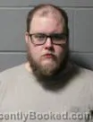 Mugshot of Tanner John Jacobs booked in Clinton County, Iowa on October 4, 2026