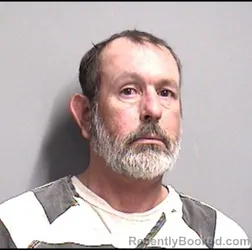 Mugshot of TRACY LEE MOORE booked in Dallas County, Iowa on March 12, 2026