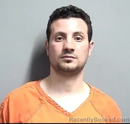 Mugshot of MINA FAYEZ YASSA KOLTA booked in Dallas County, Iowa on May 7, 2026
