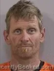 Mugshot of TRAVIS DOUGLAS MINER booked in Dickinson County, Iowa on May 13, 2026